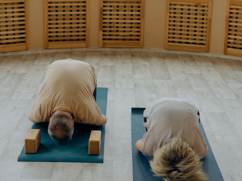 Beautifully minimalist yoga studio space with wooden floors